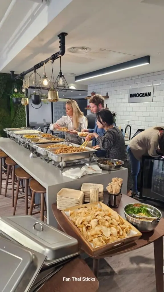 Thai buffet counter set up in an open-plan office kitchen