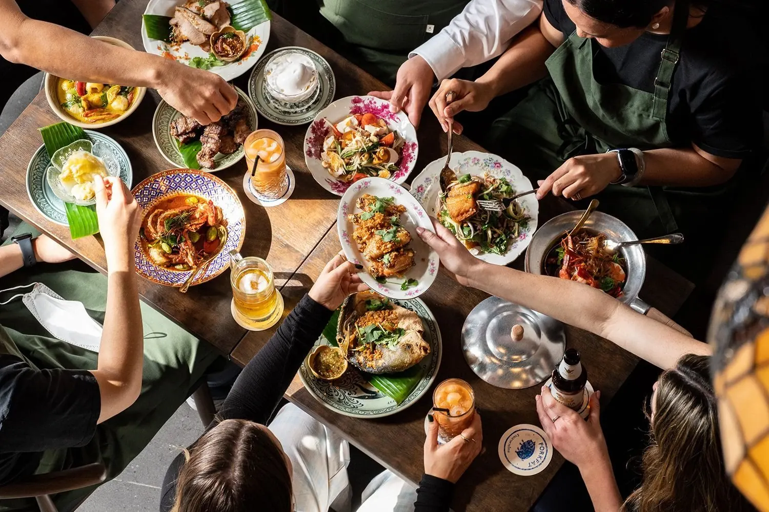 Thai sharing dishes laid out on a table